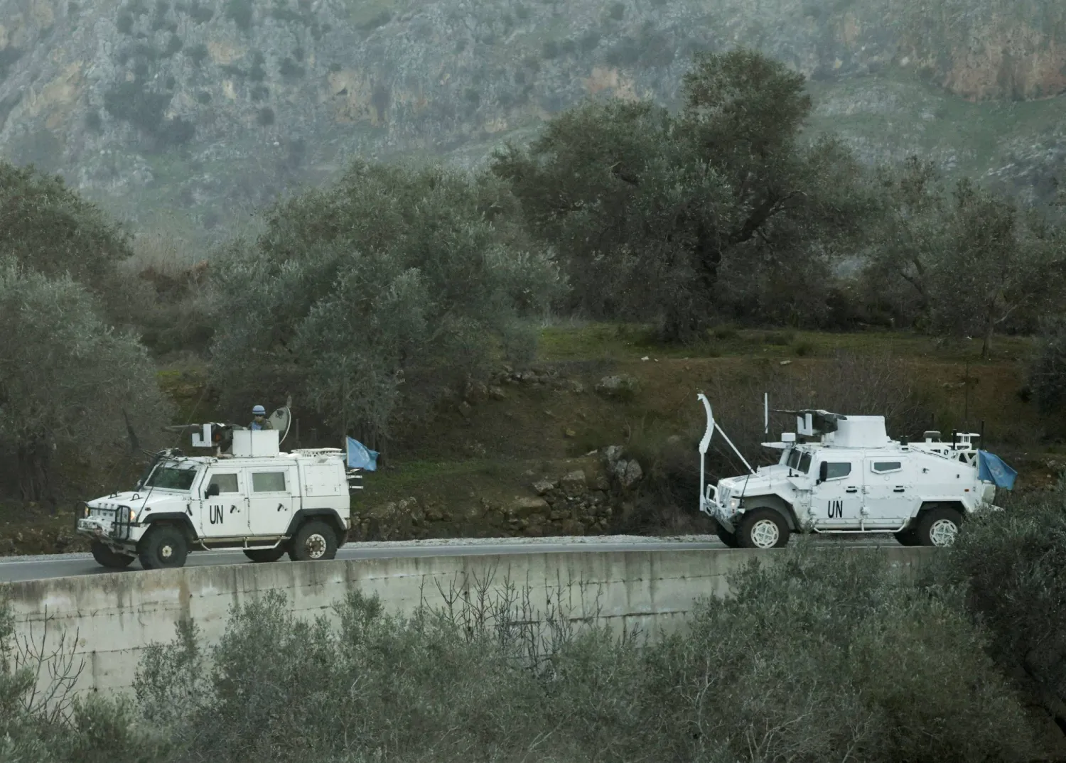 FILE PHOTO: UN peacekeepers (UNIFIL) vehicles ride along a street in Marjaayoun, Southern Lebanon January 20, 2025. REUTERS/Mohamed Azakir/File Photo