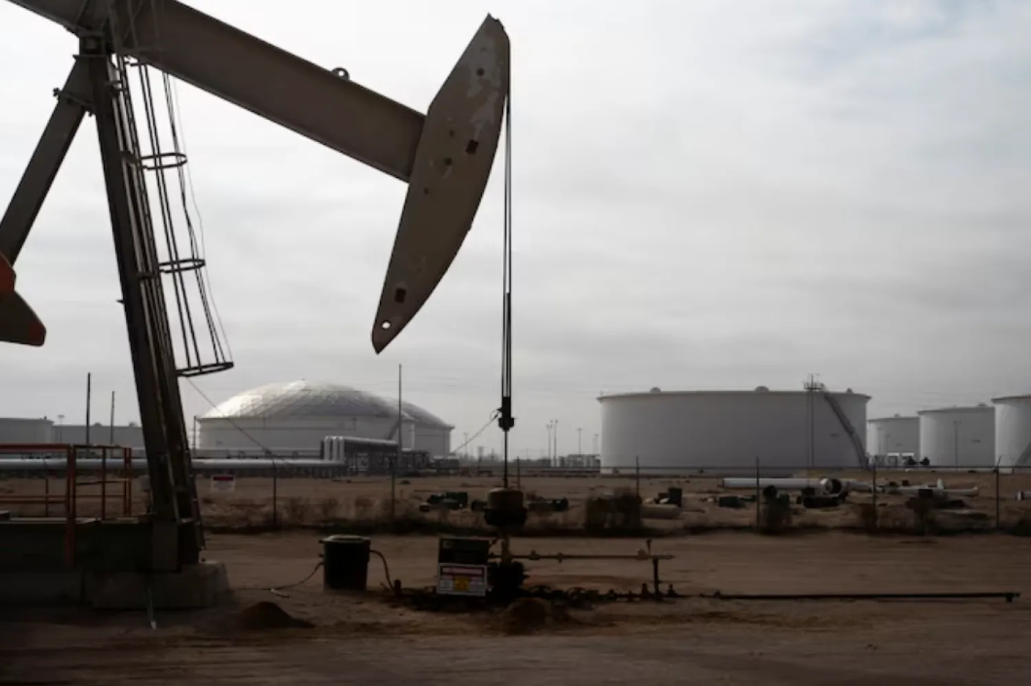 A pump jack operates near a crude oil reserve in the Permian Basin oil field near Midland, Texas, US February 18, 2025. REUTERS/Eli Hartman/File Photo