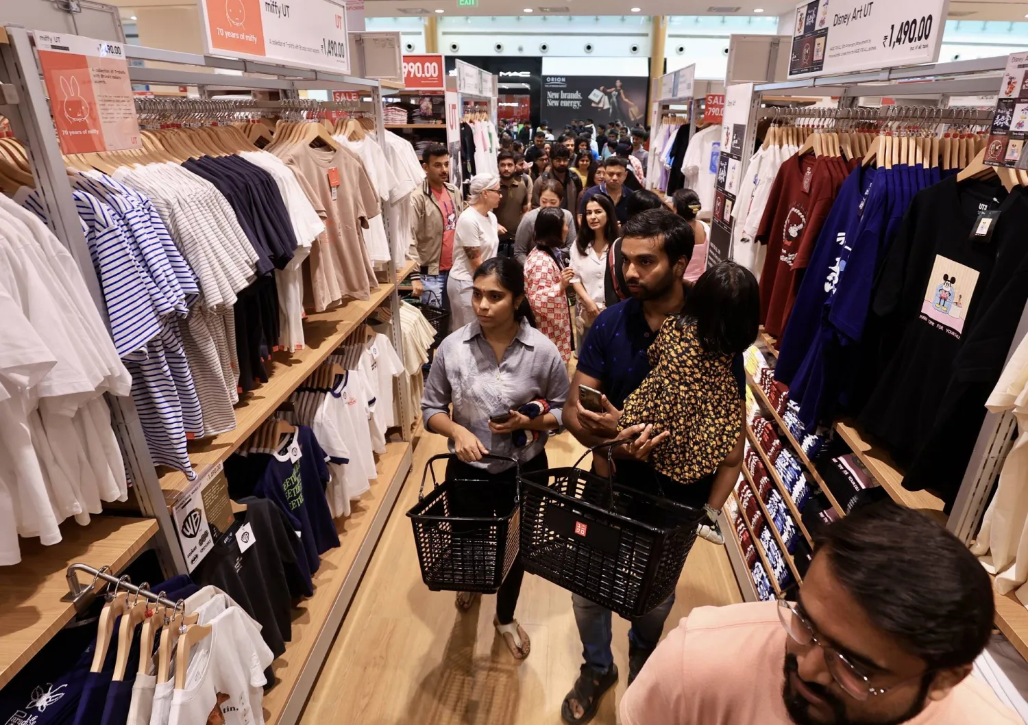 People shop at the newly launched 'UNIQLO' apparel retailer store in Bangalore, India, 29 August 2025. EPA/JAGADEESH NV