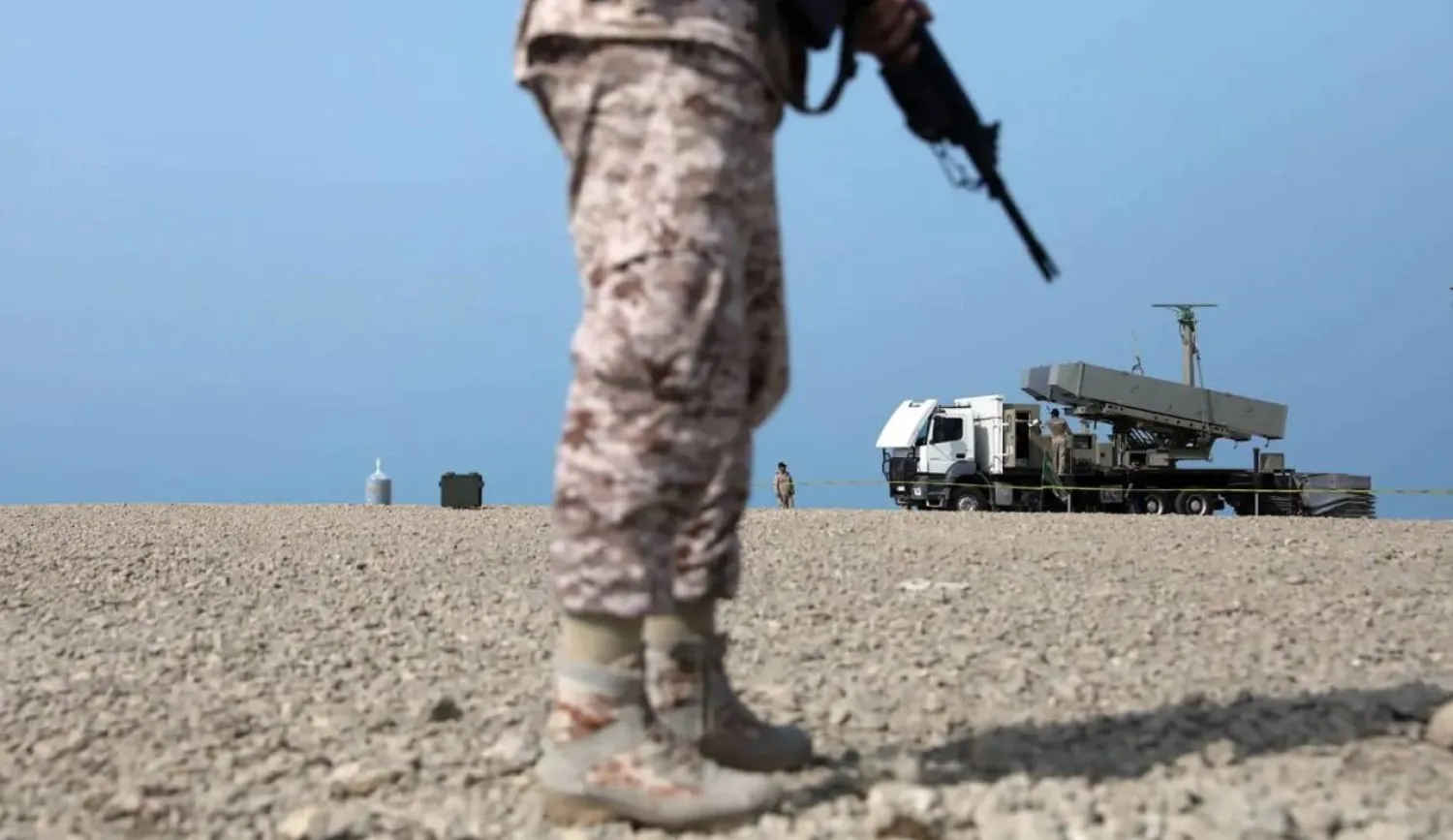 A handout picture provided by the Iranian Army office on August 21, 2025, shows a soldier standing near a rocket launcher during a military drill in an undisclosed location in southern Iran. (Photo by Iranian Army Media Office / AFP)