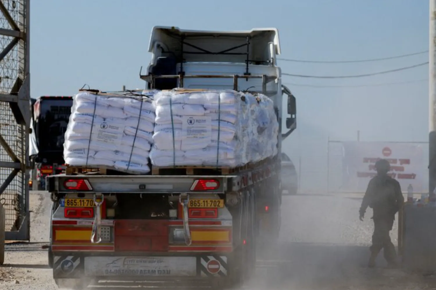 A truck carries humanitarian aid destined for the Gaza Strip, amid the ongoing conflict in Gaza between Israel and Hamas, at the Kerem Shalom crossing in southern Israel, November 11, 2024. REUTERS/Amir Cohen/File Photo