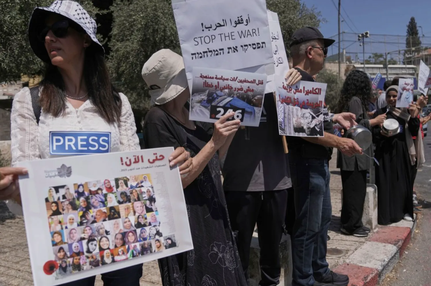 Palestinian and Israeli activists and journalists take part in a protest against the killing of Palestinian journalists in the Gaza Strip, as they gather in Nazareth, Israel, Friday, Aug. 29, 2025. (AP Photo/Mahmoud Illean)
