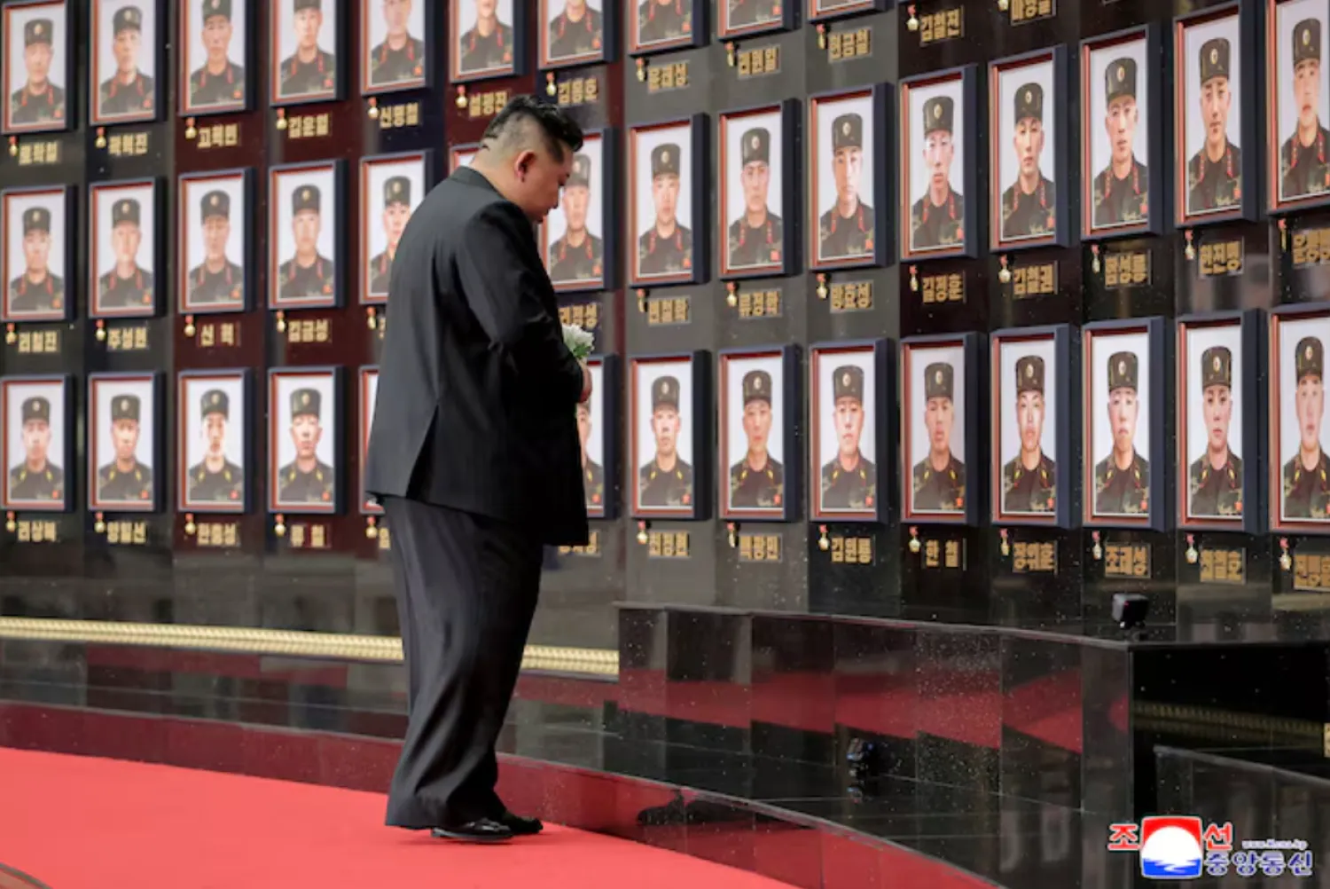 North Korean leader Kim Jong pays homage to the soldiers killed during operations as he attends a national commendation ceremony for the commanders and fighters of the Korean People's Army's overseas operations unit, at the headquarters of the Central Committee of the Korean Workers' Party, in Pyongyang, North Korea - Reuters
