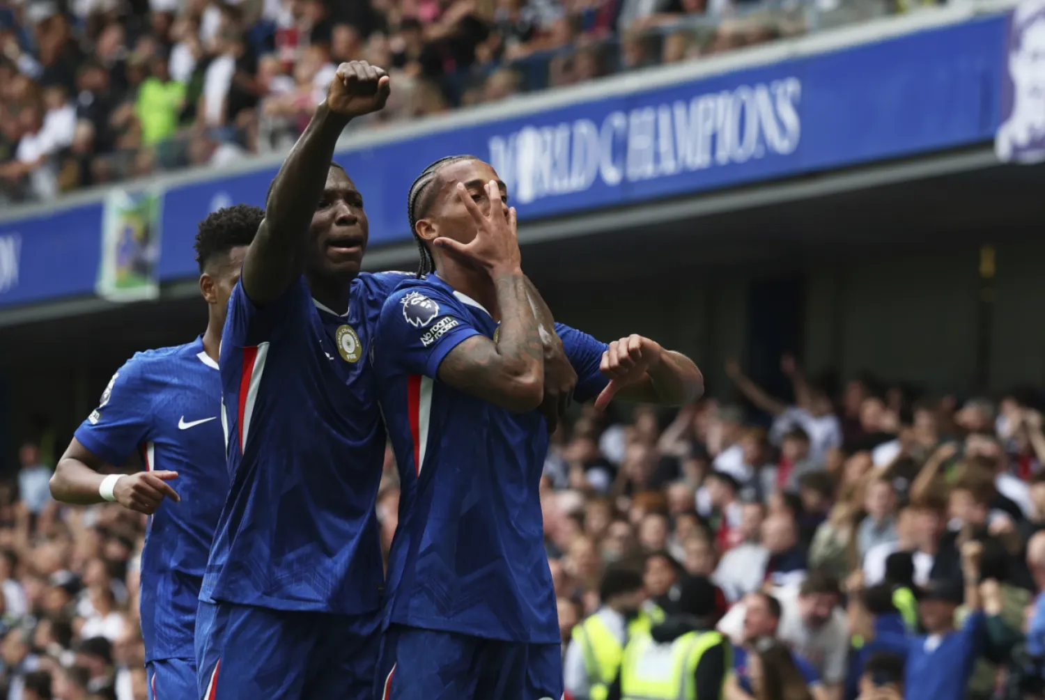 Chelsea's Joao Pedro, right, celebrates with teammates after scoring the opening goal during the English Premier League soccer match between Chelsea and Fulham at Stamford Bridge stadium in London, Saturday, Aug 30, 2025. (AP Photo/lan Walton)