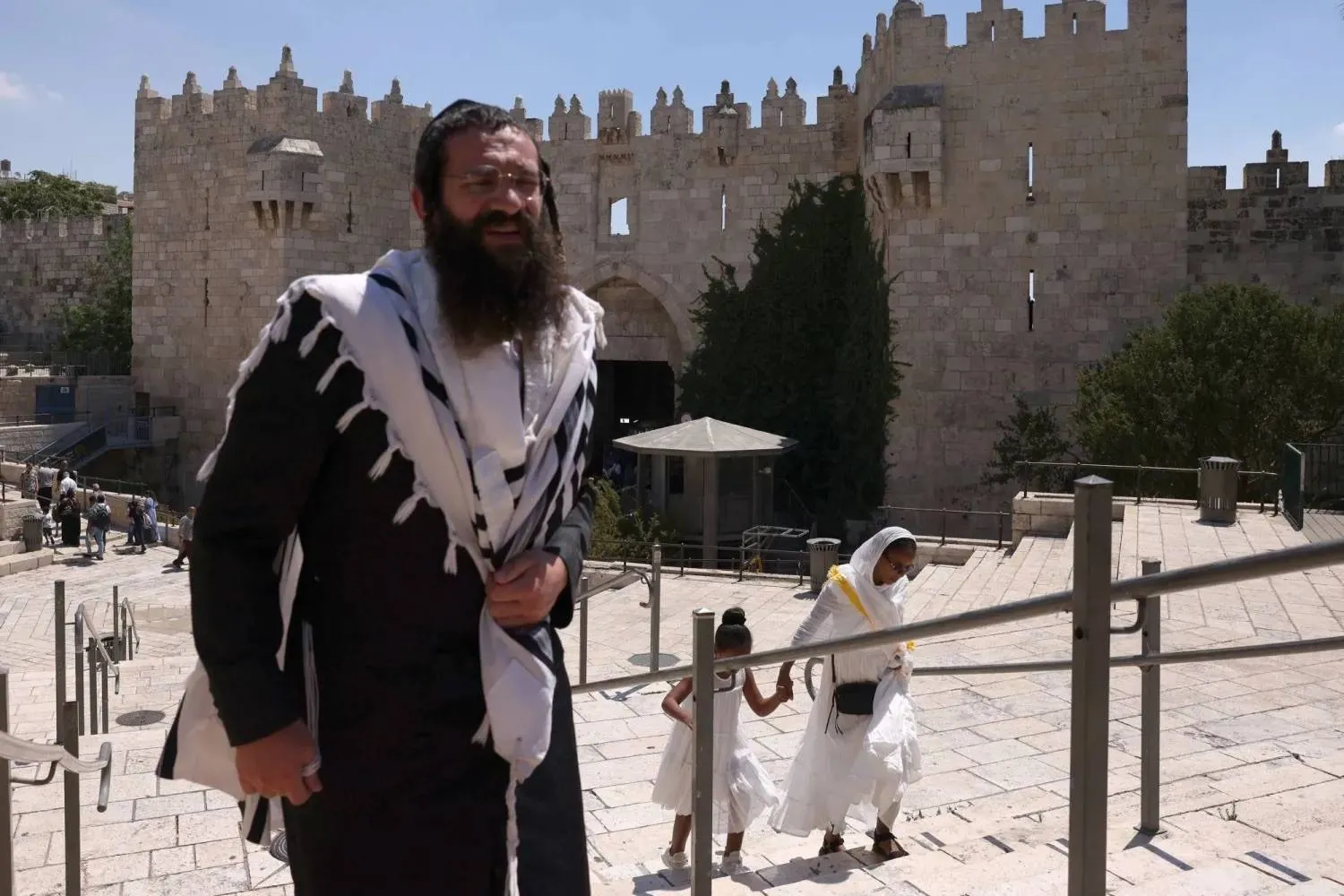 An ultra-Orthodox Jew walks near Damascus Gate in Jerusalem’s Old City on August 30, 2025 (AFP). 