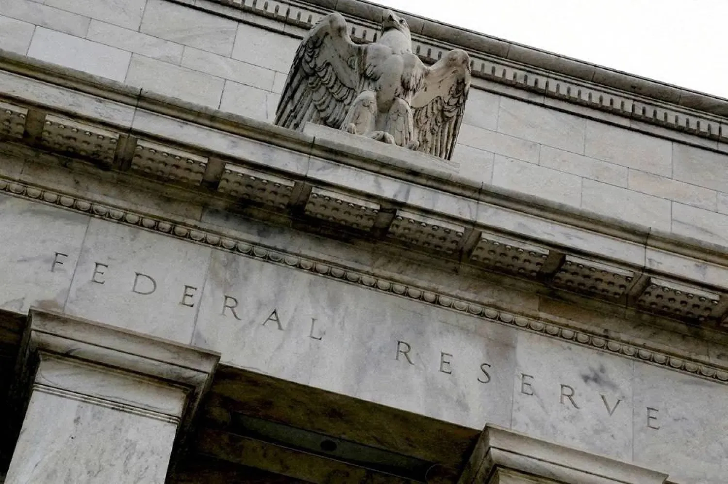 An eagle tops the US Federal Reserve building's facade in Washington, July 31, 2013. (Reuters)
