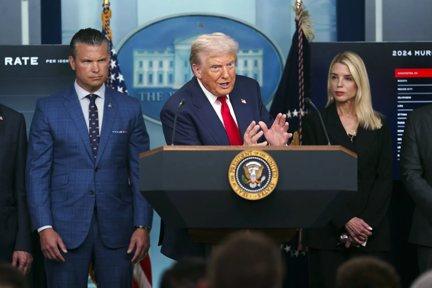US President Donald Trump (C) with US Defense Secretary Pete Hegseth (L) and US Attorney General Pam Bondi (R) addresses the media in the James S. Brady Press Briefing Room of the White House, Washington, DC, USA, 11 August 2025. (EPA) 