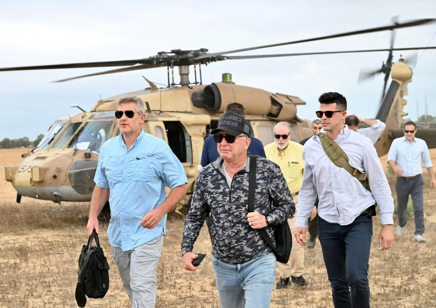 US Special Envoy to the Middle East Steve Witkoff and US Ambassador to Israel, Mike Huckabee walk during their visit to the Gaza Strip, August 1, 2025. (Ambassador Mike Huckabee via X/Handout via Reuters) 