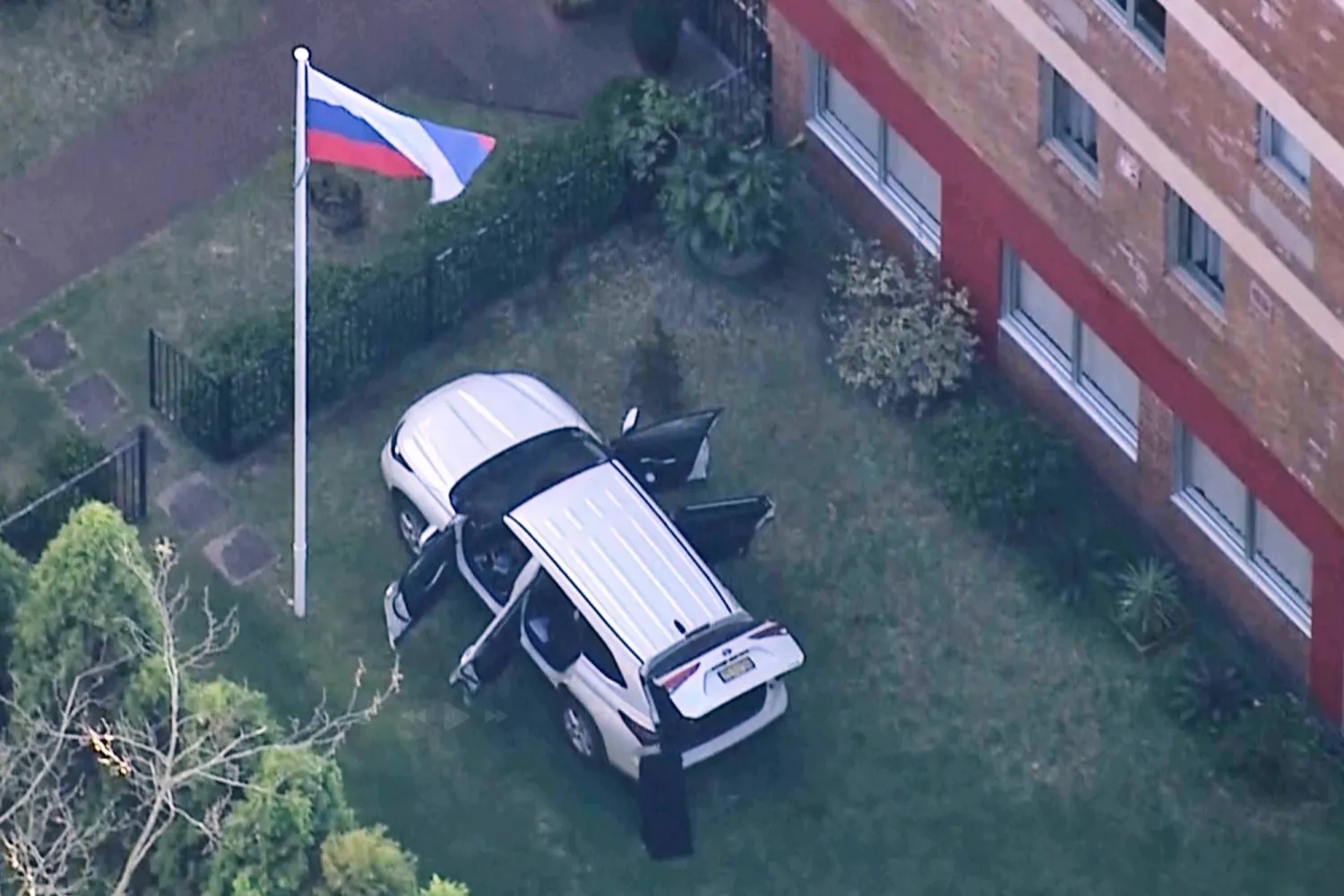 In this image made from video, a car is seen in the grounds of the Russian consulate in Sydney, Australia, Monday, Sept. 1, 2025. (AuBC/CH7 AUSTRALIA/CH9 AUSTRALIA via AP)