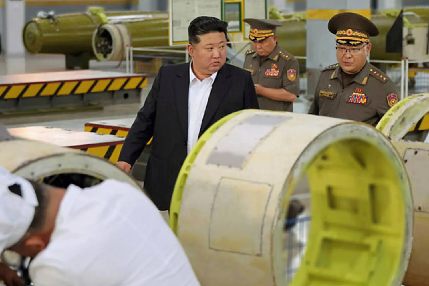 This photo provided Monday, Sept. 1, 2025, by the North Korean government, North Korean leader Kim Jong Un inspects a new weapons factory in undisclosed location, North Korea, on Aug. 31, 2025. (Korean Central News Agency/Korea News Service via AP)