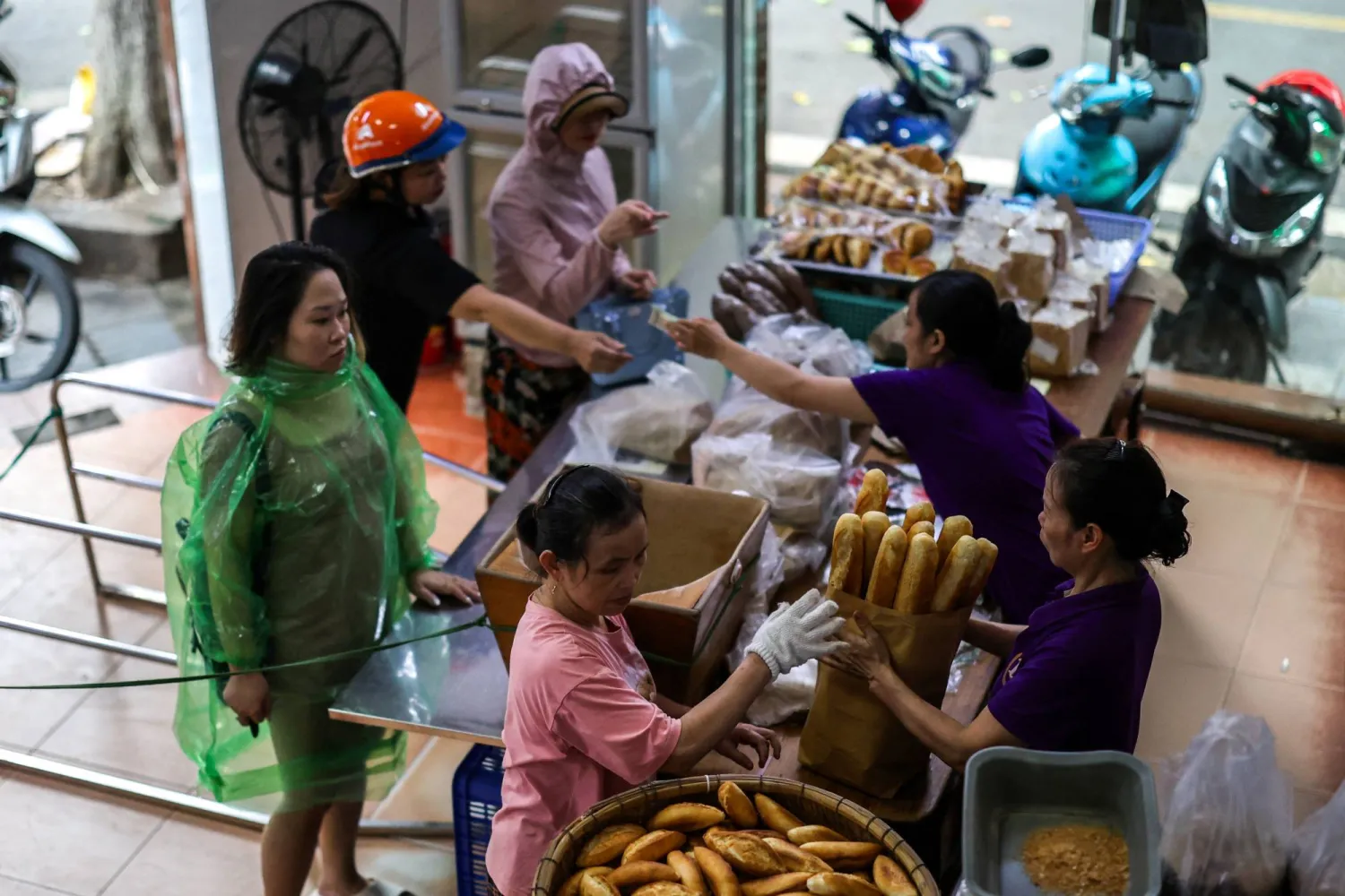 Customers buy baguettes at the Hoan Boulangerie bakery shop in Hanoi, Vietnam, August 30, 2025. (Reuters)