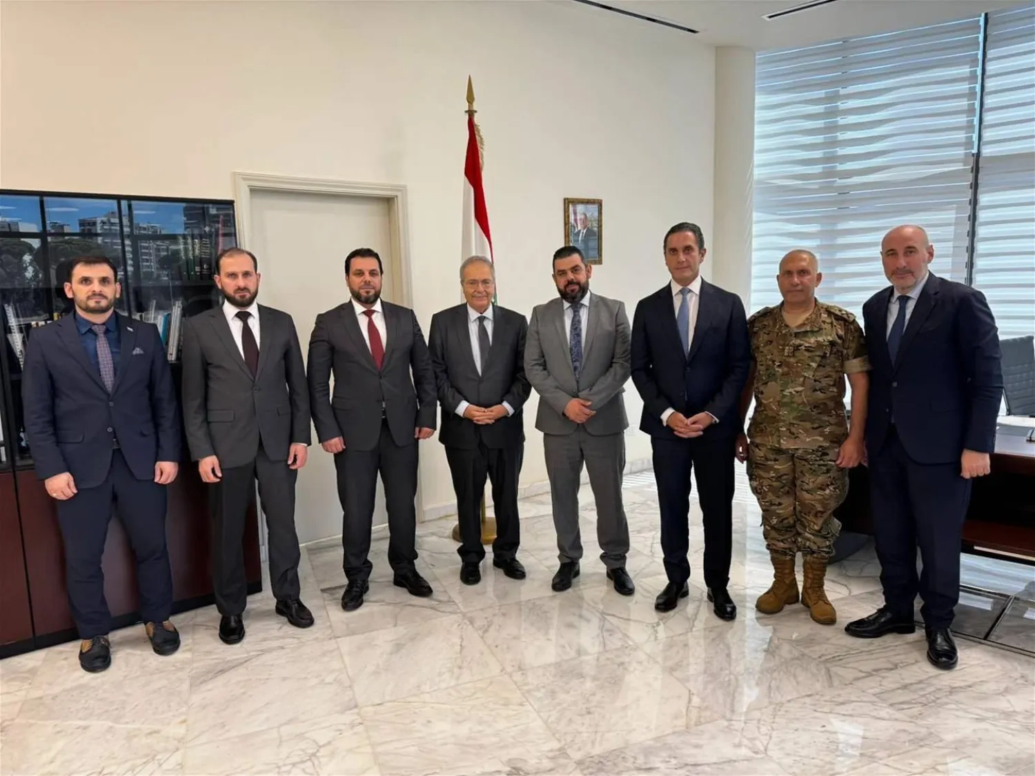 Deputy Prime Minister Tarek Mitri (center) with Syrian officials during Monday's meeting. (X)