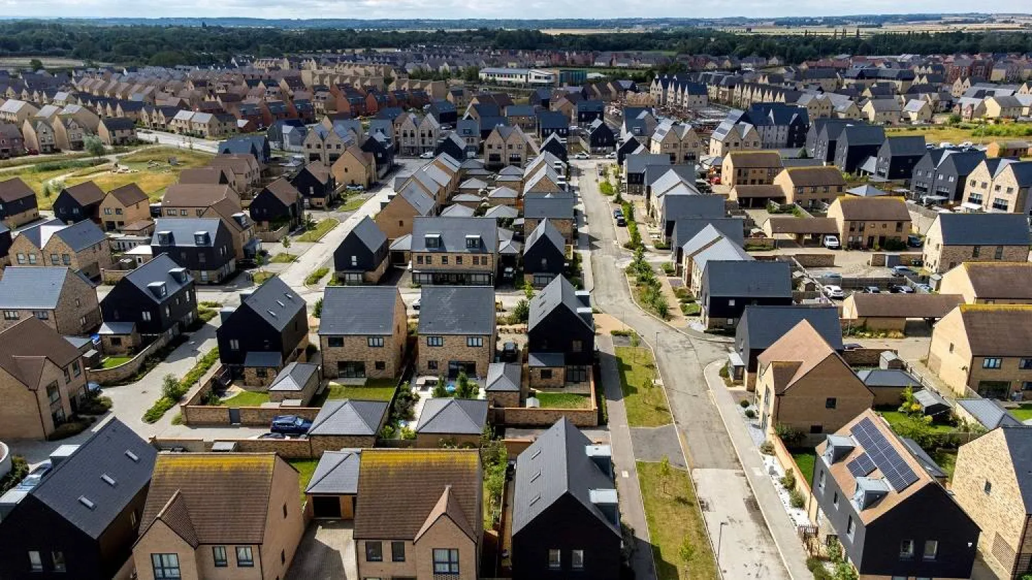 An aerial view shows newly built homes in the new town of Northstowe, eastern England on July 31, 2025. (AFP)