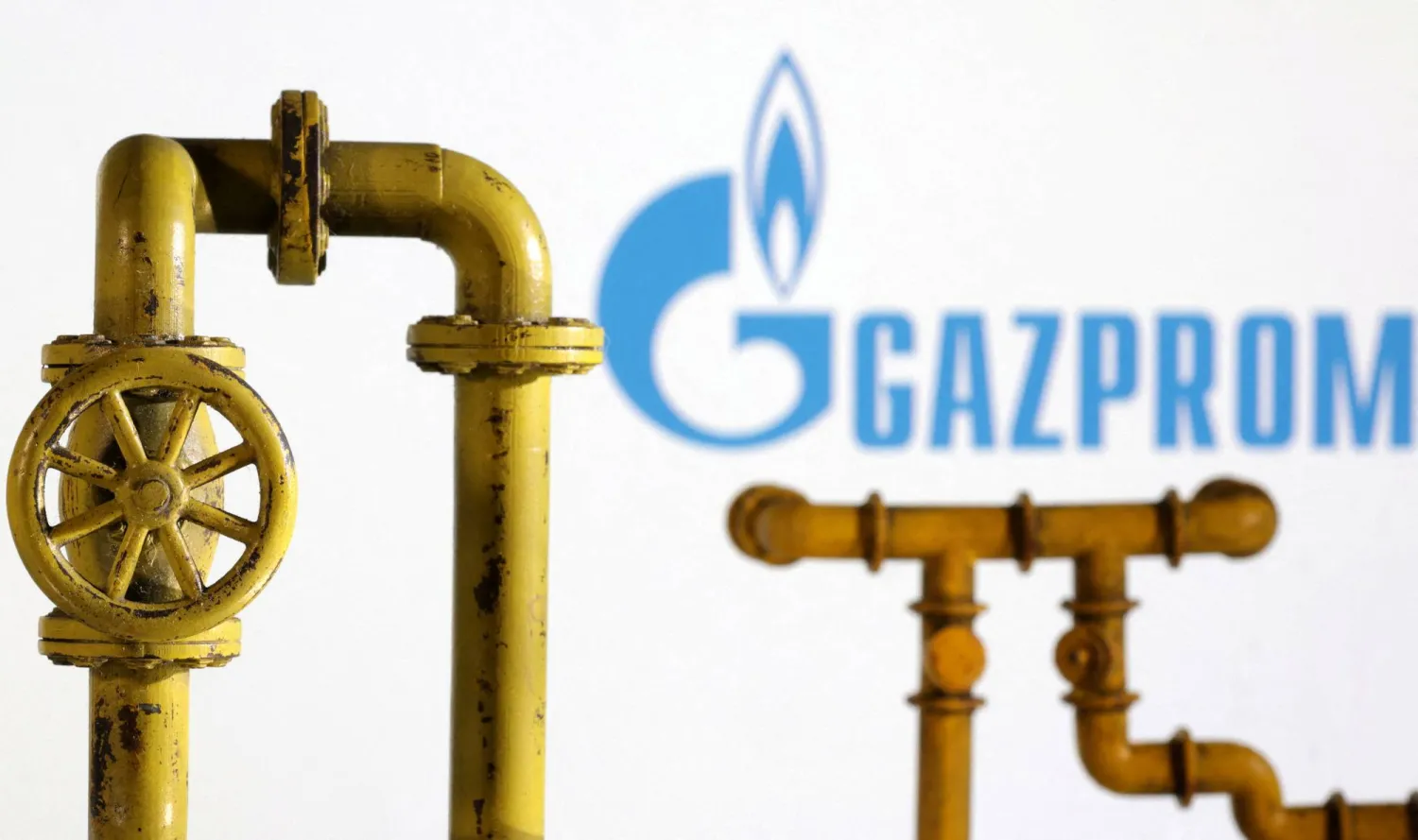FILE PHOTO: Model of natural gas pipeline and Gazprom logo, July 18, 2022. REUTERS/Dado Ruvic/Illustration/File Photo