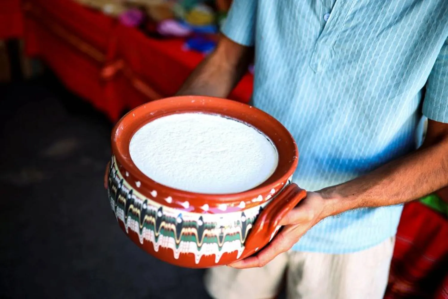 A local producer shows Bulgarian yogurt displayed during the Yogurt Festival in the village of Momchilovtsi, Bulgaria, August 30, 2025. (Reuters) 