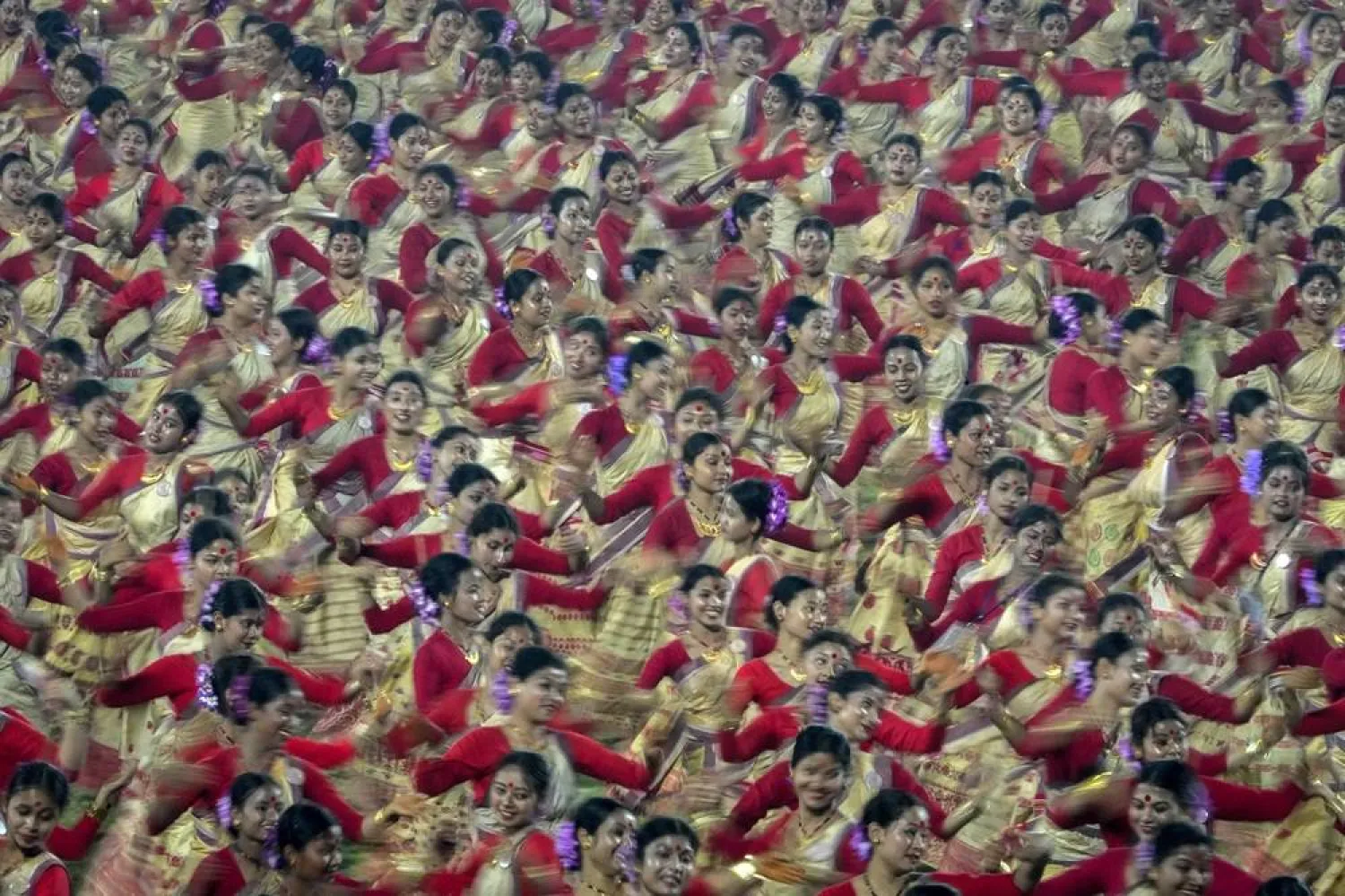 Assamese dancers in traditional attire perform as they attempt Guinness World Record in the largest folk dance performance category in Guwahati, India, Friday, April 14, 2023. (AP)