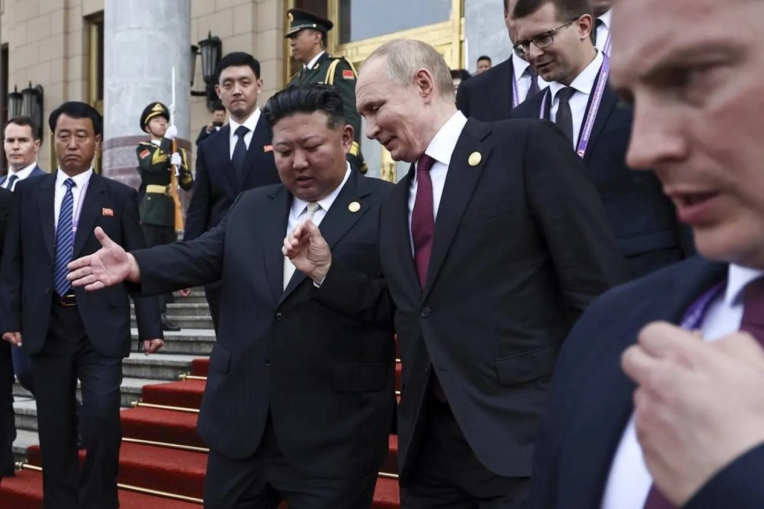 Russian President Vladimir Putin, second right, and North Korean leader Kim Jong Un gesture as they leave a reception following a military parade to commemorate the 80th anniversary of the end of World War II in Beijing, China, Wednesday, Sept. 3, 2025. (Alexander Kazakov, Sputnik, Kremlin Pool Photo via AP)