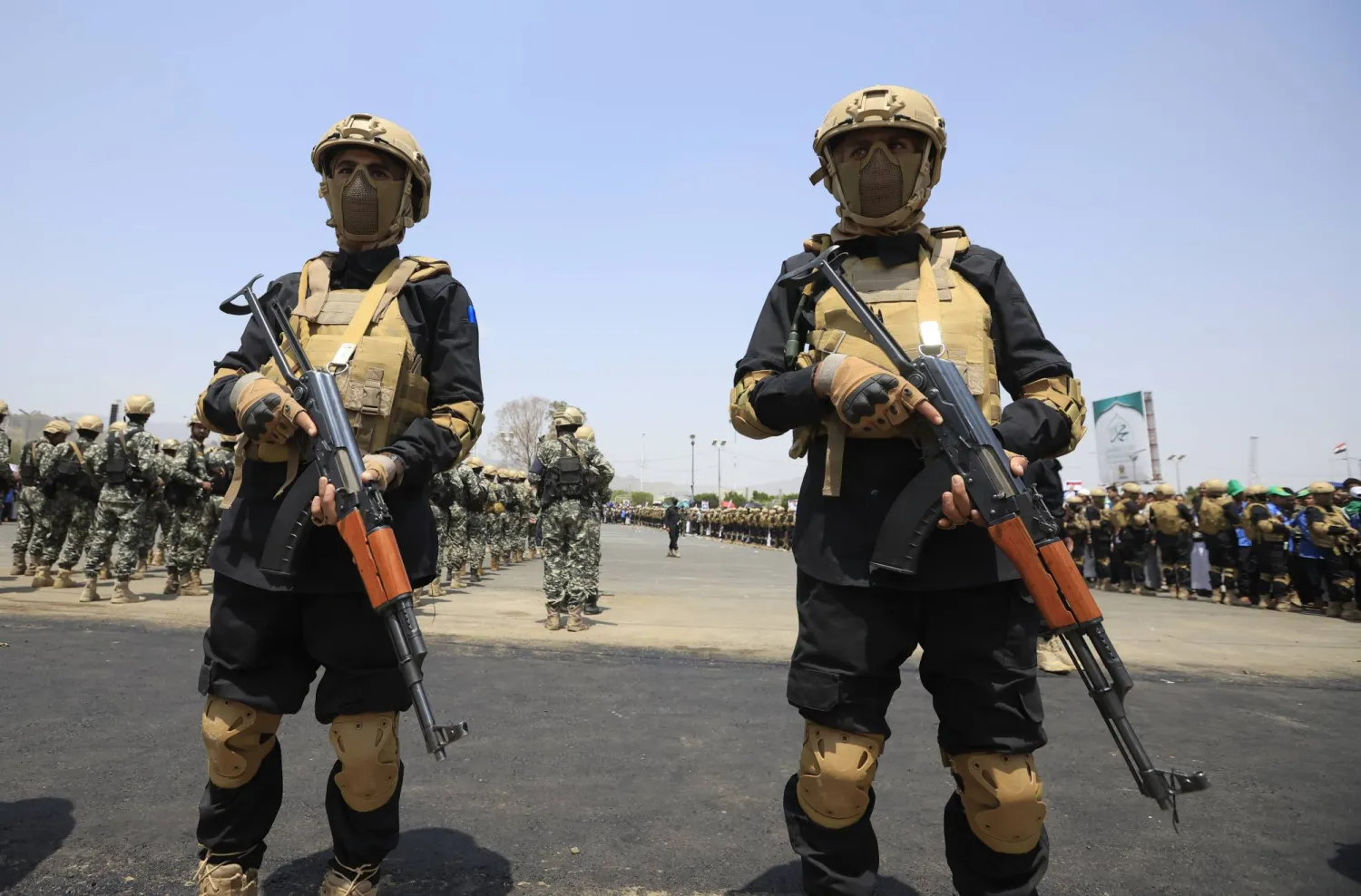 Houthi fighters stand guard during the funeral of senior Houthi officials who were killed in recent Israeli strikes, during a funeral in Sanaa, Yemen, 01 September 2025. EPA/YAHYA ARHAB