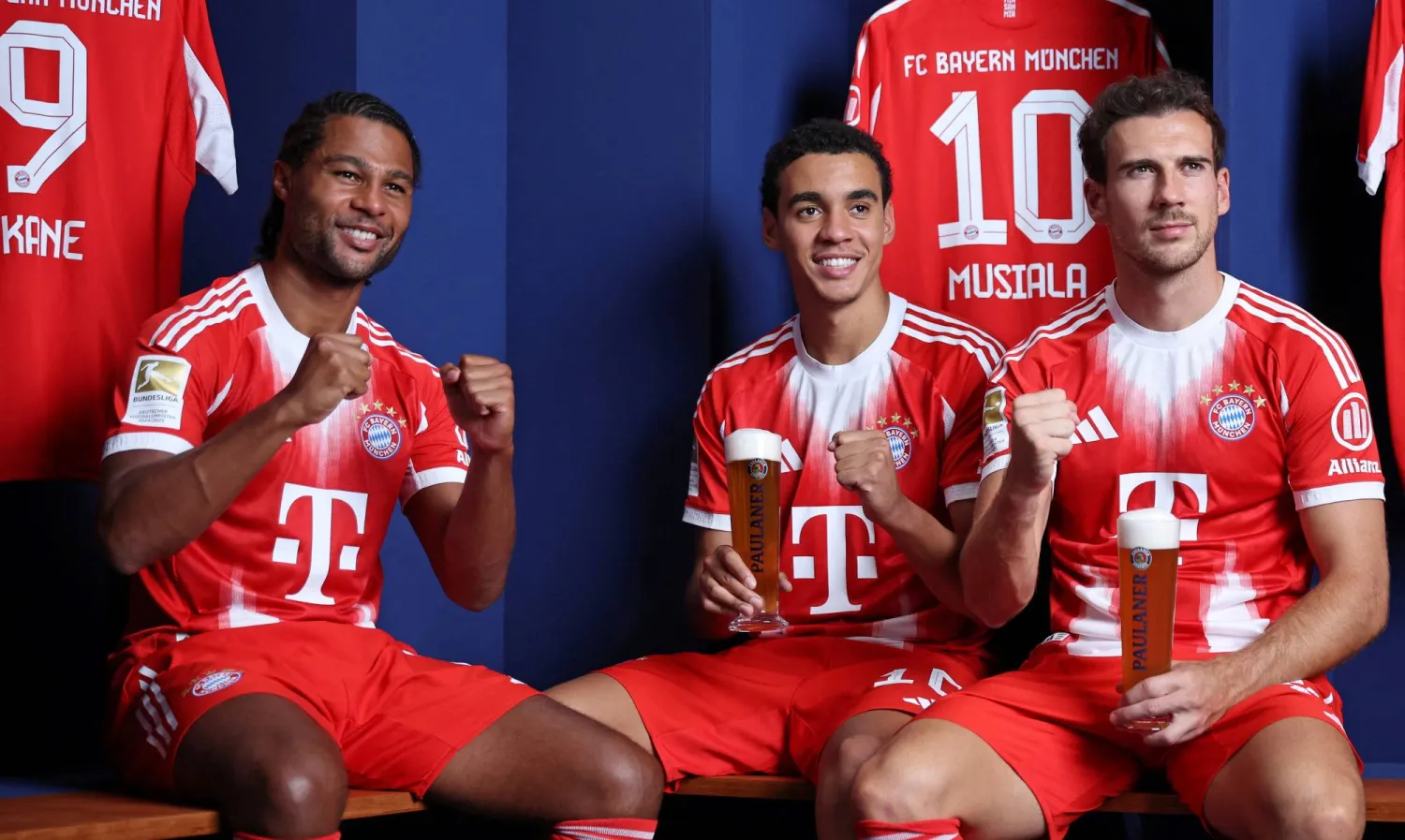 Soccer Football - Bayern Munich's Serge Gnabry, Jamal Musiala and Leon Goretzka pose during a traditional photoshoot held annually before the Oktoberfest beer festival - Munich, Germany - August 19, 2025. Stefan Matzke/Bayern Munich and Paulaner/Handout via REUTERS
