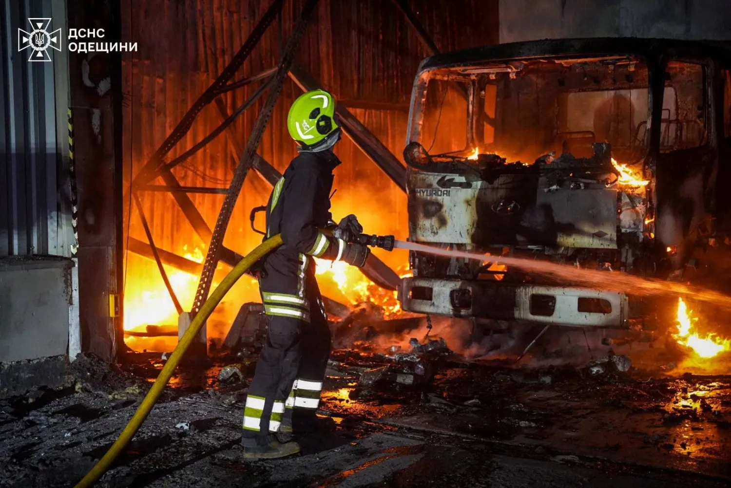 A firefighter works at the site of a warehouse hit by a Russian drone strike, amid Russia's attack on Ukraine, in Odesa, Ukraine September 4, 2025. Press service of the State Emergency Service of Ukraine in Odesa region/Handout via REUTERS