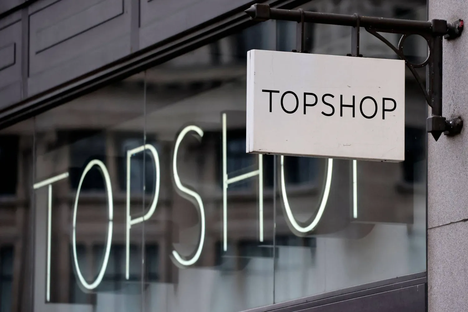 (FILES) A sign is pictured outside a closed branch of the fashion retailer Topshop in central London on February 1, 2021. (Photo by Tolga Akmen / AFP)