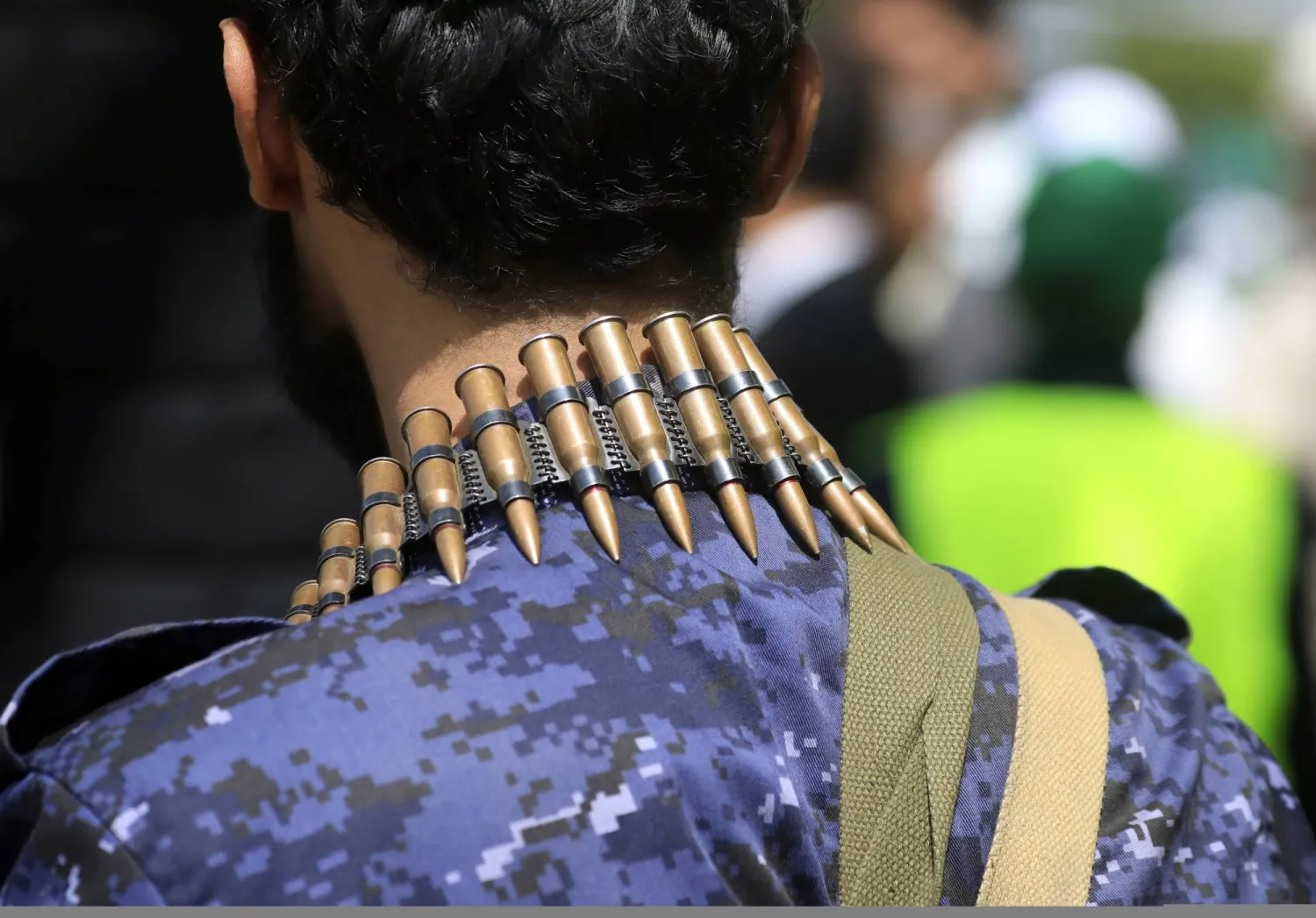 A Houthi militia member wears a machine gun bullet belt while on patrol during a rally against the Israeli strikes in Sanaa, Yemen, 03 September 2025. EPA/YAHYA ARHAB