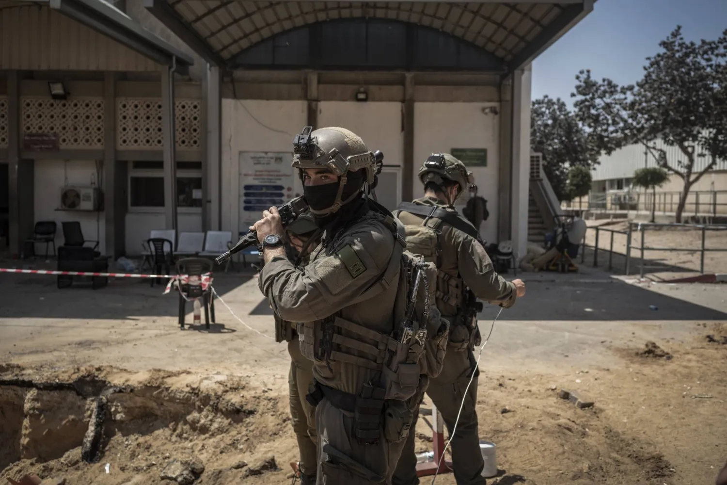 FILED - 08 June 2025, Palestinian Territories, Khan Yunis: Israeli soldiers stand guard at the European Hospital in Khan Yunis, where the Israeli military discovered a tunnel believed to be the site of Hamas military chief Muhammad Sinwar's death last month. Photo: Ilia Yefimovich/dpa