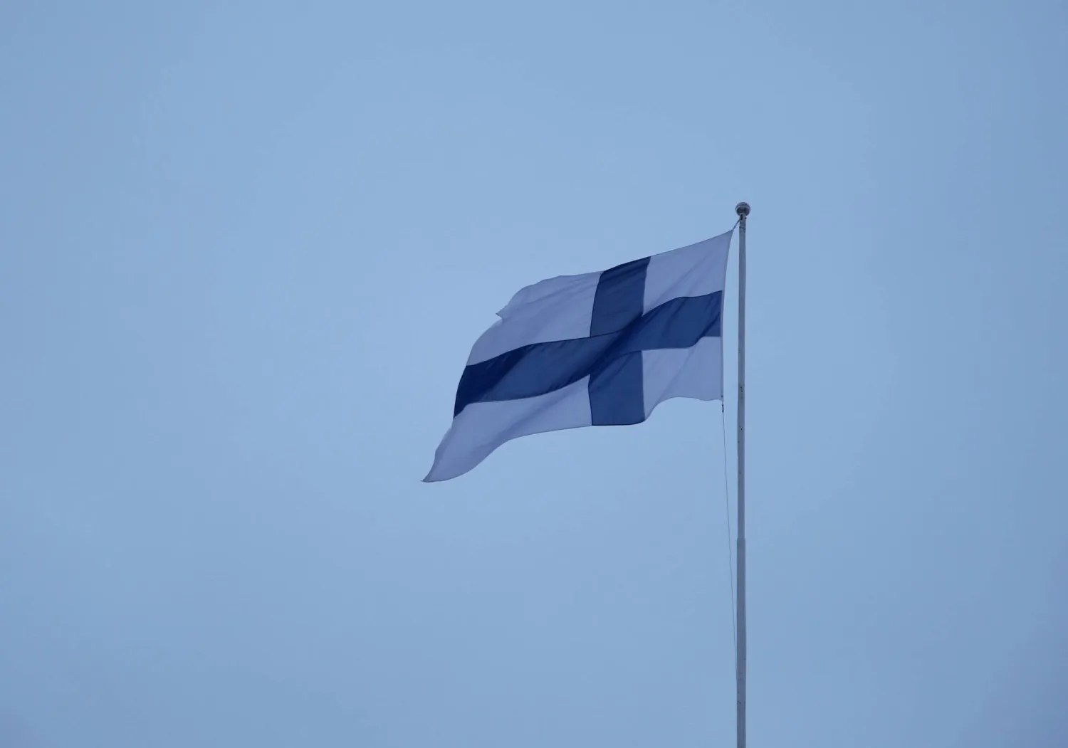 A Finnish flag flies over the City Hall in Helsinki, Finland, February 10, 2024. REUTERS/Tom Little/File photo 