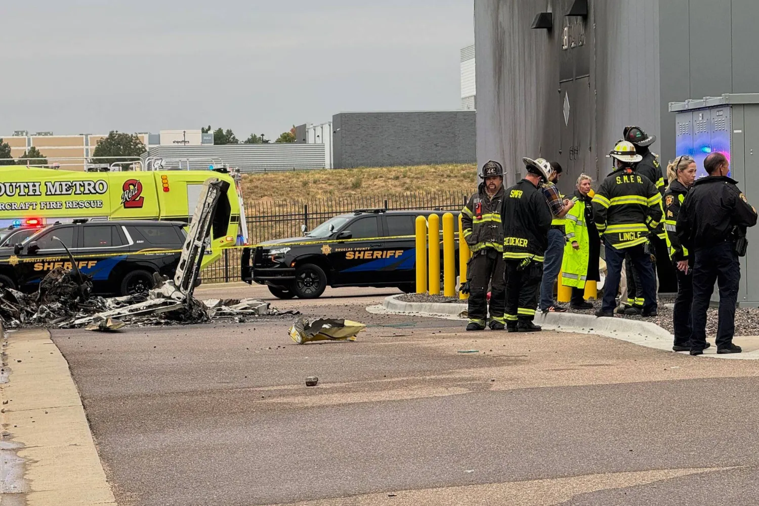 Firefighters and sheriff's deputies are seen responding to the scene of a deadly plane crash in suburban Denver in on Friday, Sept. 5, 2025, in Greenwood Village, Colo. (Deborah Takahara/Douglas County Sheriff's Office via AP)