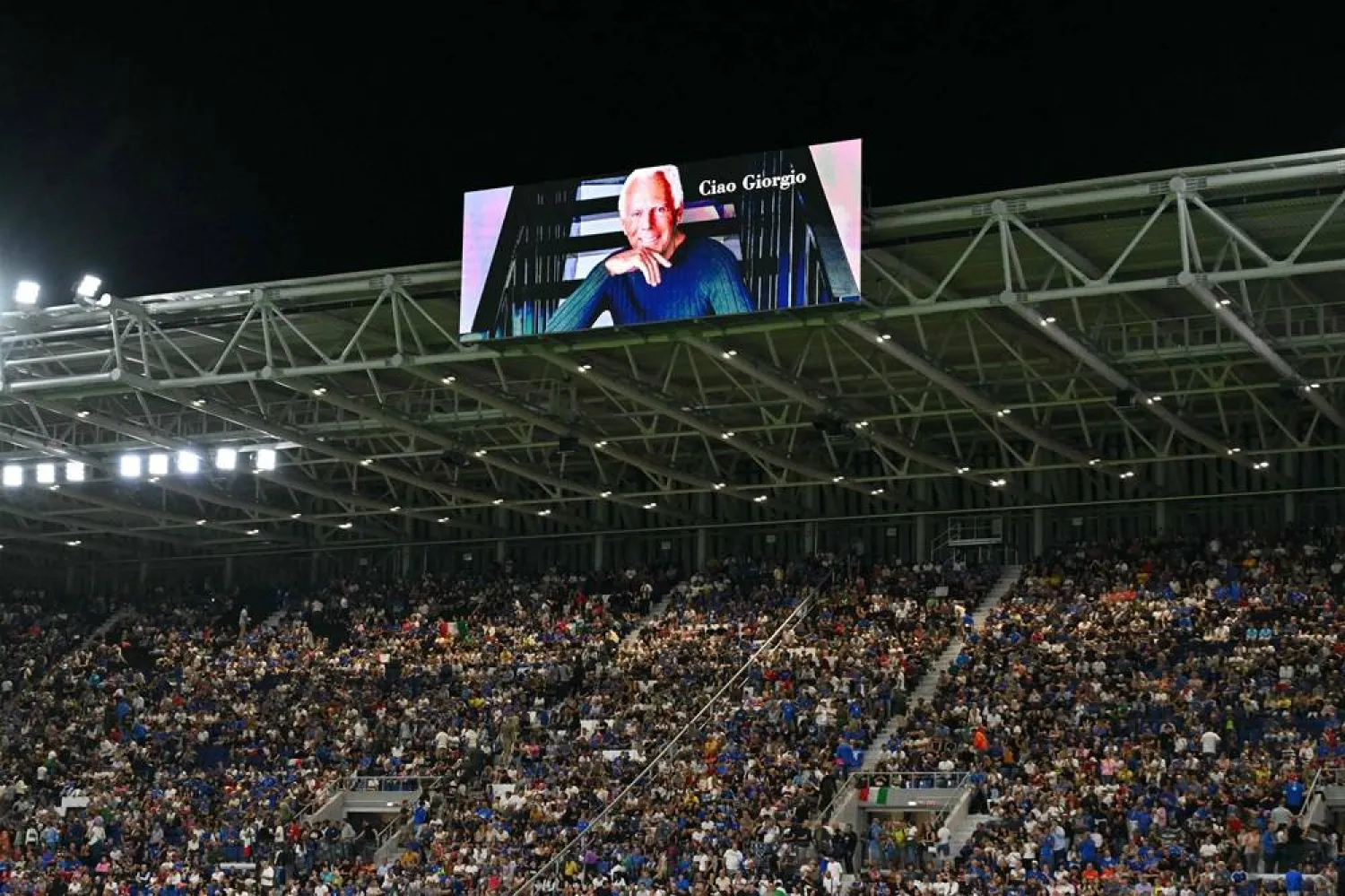An image of the late Italian fashion designer Giorgio Armani is shown on the jumbotron during the warm up ahead of the FIFA World Cup 2026 Group I qualification football match between Italy and Estonia at the Stadio di Bergamo, in Bergamo, on September 5, 2025. (AFP)