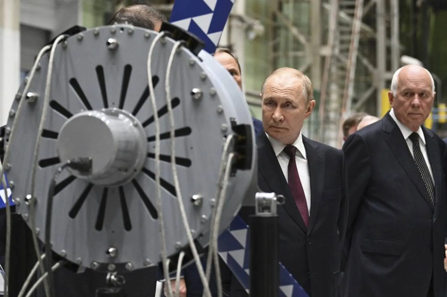  Russian President Vladimir Putin, left, accompanied by Rostec Corporation CEO Sergei Chemezov, right, visits the Kuznetsov Design Bureau, an aircraft engines facility in Samara, Russia, Friday, Sept. 5, 2025. (Kristina Kormilitsyna, Sputnik, Kremlin Pool Photo via AP) 