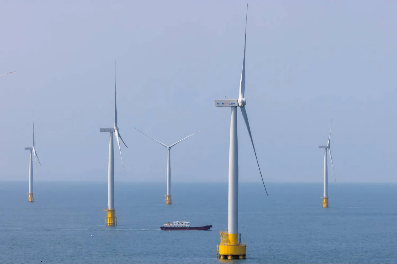A ship sails between wind turbines in the Taiwan strait off the coast of Pingtan Island, Fujian province, China, April 10, 2023. REUTERS/Thomas Peter/File Photo Purchase Licensing Rights