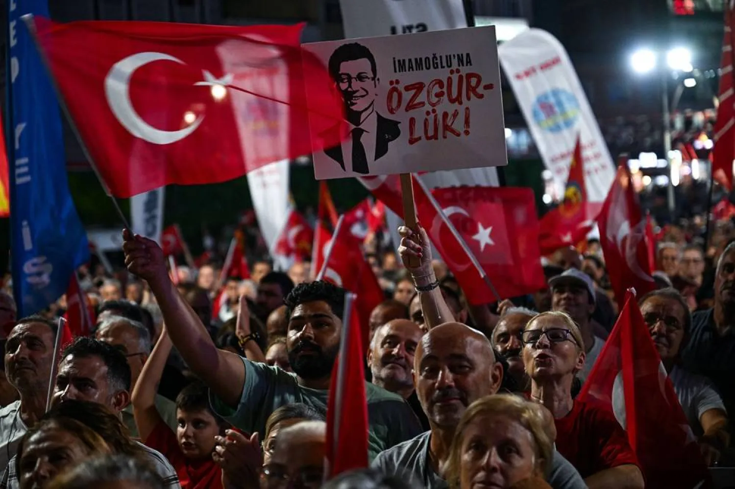 A placard reading "Freedom for Imamoglu" is seen as Republican People's Party supporters gather during a rally in support of jailed mayor of Istanbul Ekrem Imamoglu in Istanbul, on September 3,2025. (AFP) 
