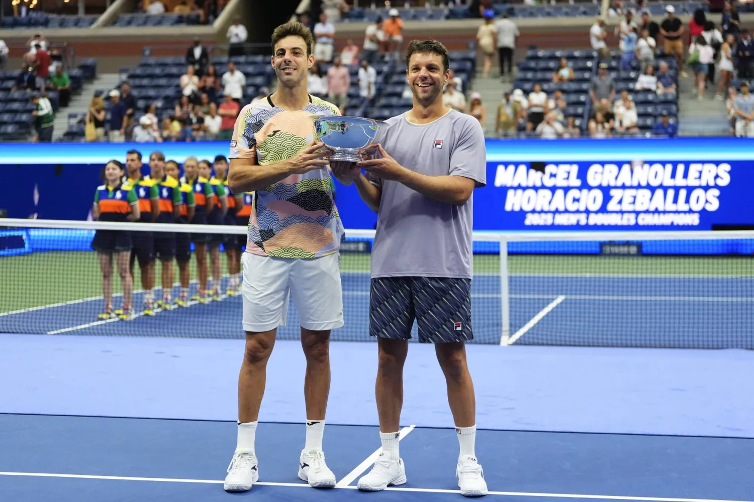 مارسيل غرانوييرس وأوراسيو سيبايوس (أ.ب)