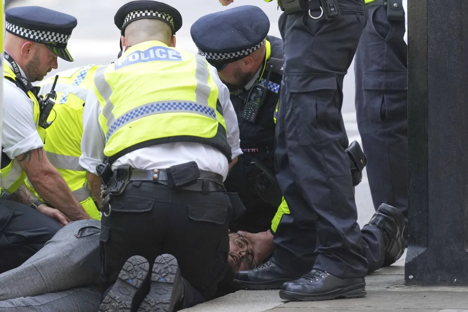 Police officers arrest a protester during a protest to support Palestine Action in London, Saturday, Sept. 6, 2025.(AP Photo/Joanna Chan)
