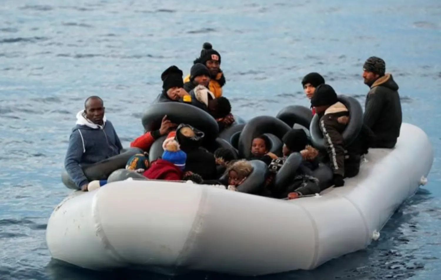 Migrants are seen on a dinghy following a failed attempt to cross to the Greek island of Lesbos, as a Turkish Coast Guard boat aproaches them, on the waters of the North Aegean Sea, off the shores of Canakkale, Türkiye, March 6, 2020. REUTERS/Umit Bektas 