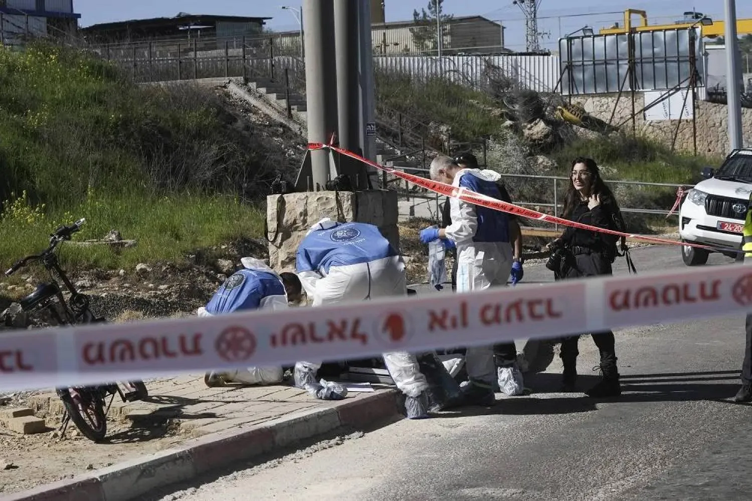 Archive: Israeli security forces inspect the scene of a stabbing attack at a checkpoint between Jerusalem and the West Bank on Wednesday, March 13, 2024. (AP)