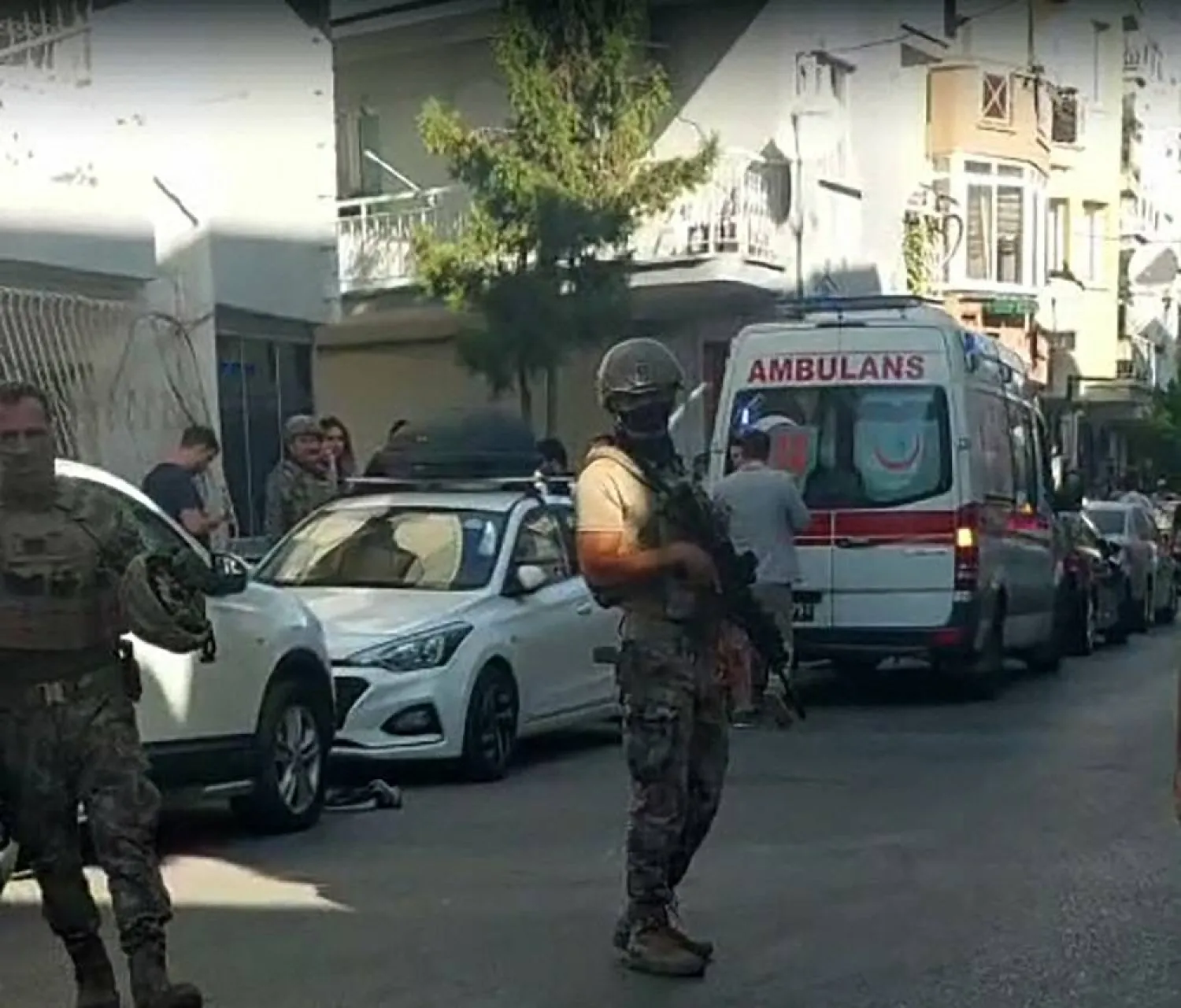 This handout photograph taken and released on September 8, 2025 by Turkish news agency DHA (Demiroren News Agency) shows Turkish special force police officers standing guard in the street in Izmir after an attack on a police station. Handout / DHA (Demiroren News Agency / AFP 