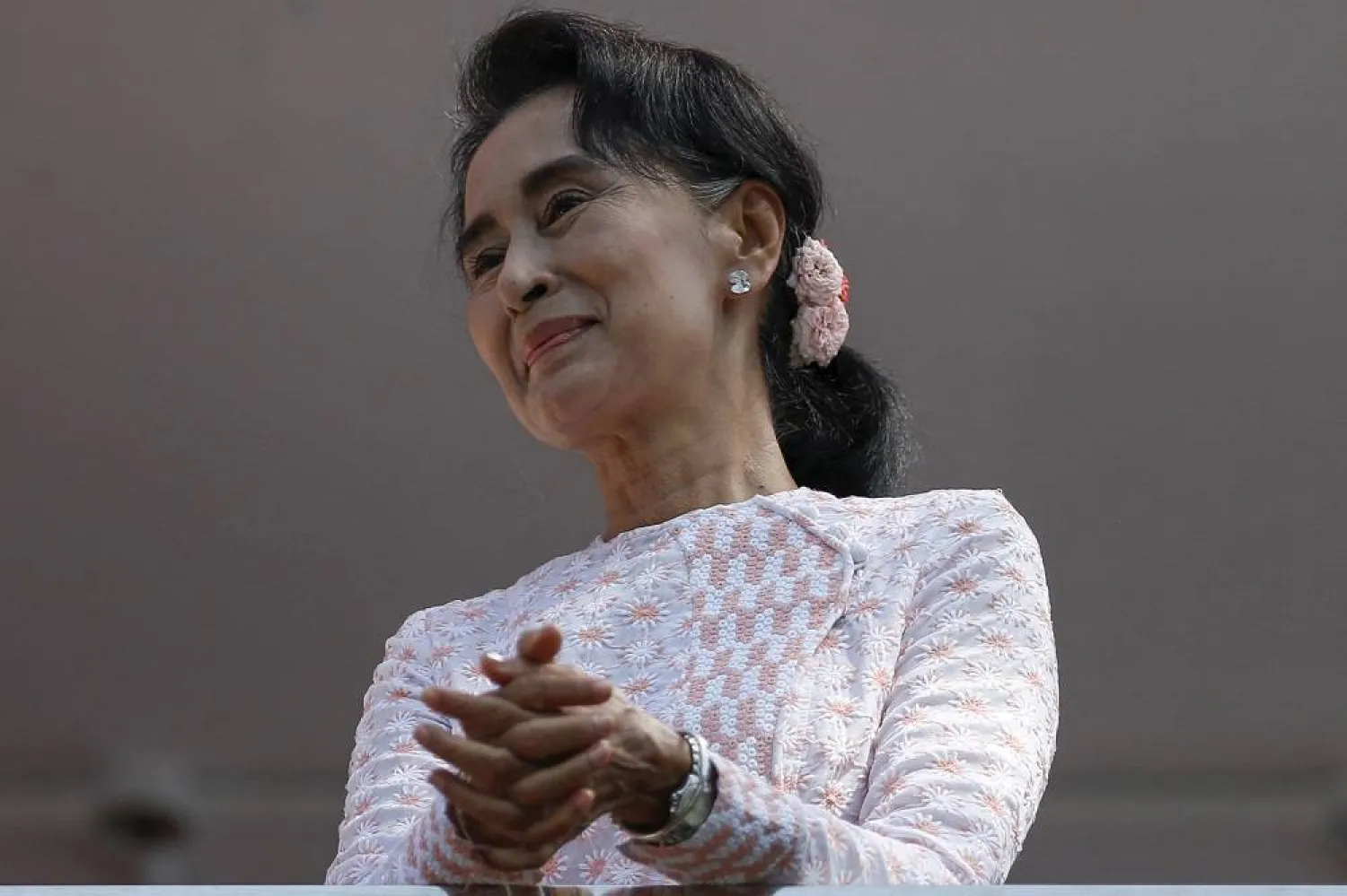 Myanmar's National League for Democracy party leader Aung San Suu Kyi looks at supporters after speaking about the general elections in Yangon, Myanmar November 9, 2015. (Reuters)
