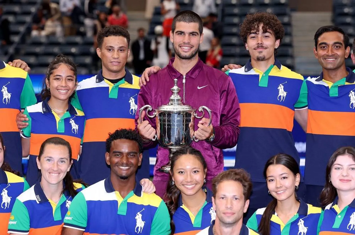 Carlos Alcaraz of Spain poses with the ball persons after defeating Jannik Sinner of Italy during their Men's Singles Final match on Day Fifteen of the 2025 US Open at USTA Billie Jean King National Tennis Center on September 07, 2025 in New York City. (Getty Images/AFP)