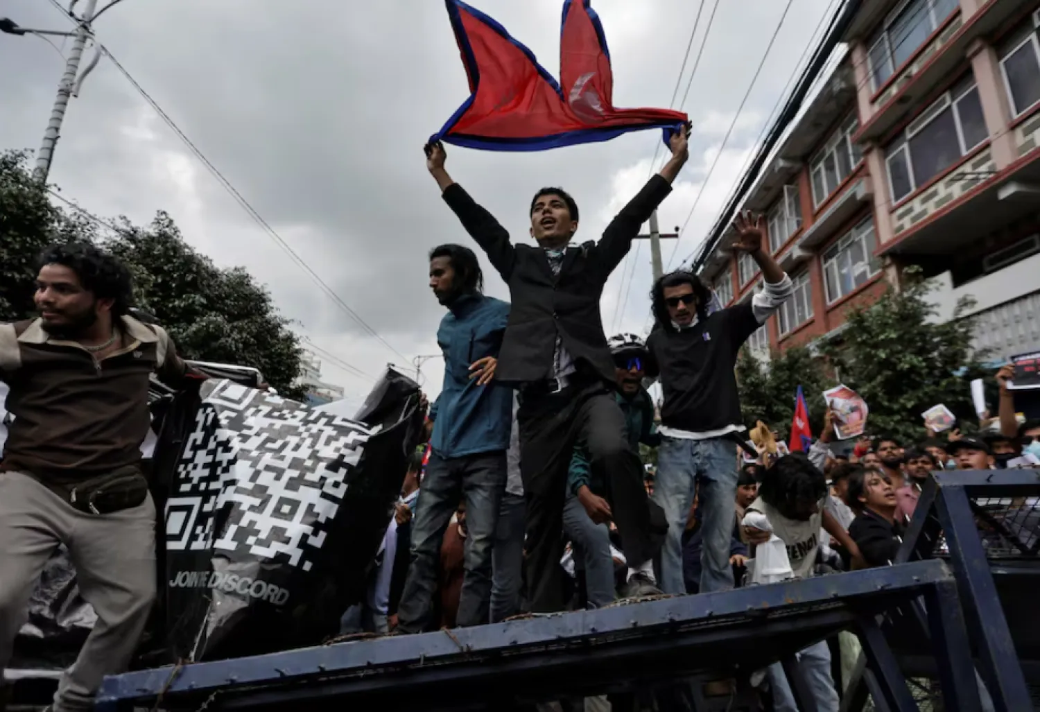 Demonstrators shout slogans as they stand on a barricade during a protest against corruption and the government’s decision to block several social media platforms, in Kathmandu, Nepal September 8, 2025. REUTERS/Navesh Chitrakar 