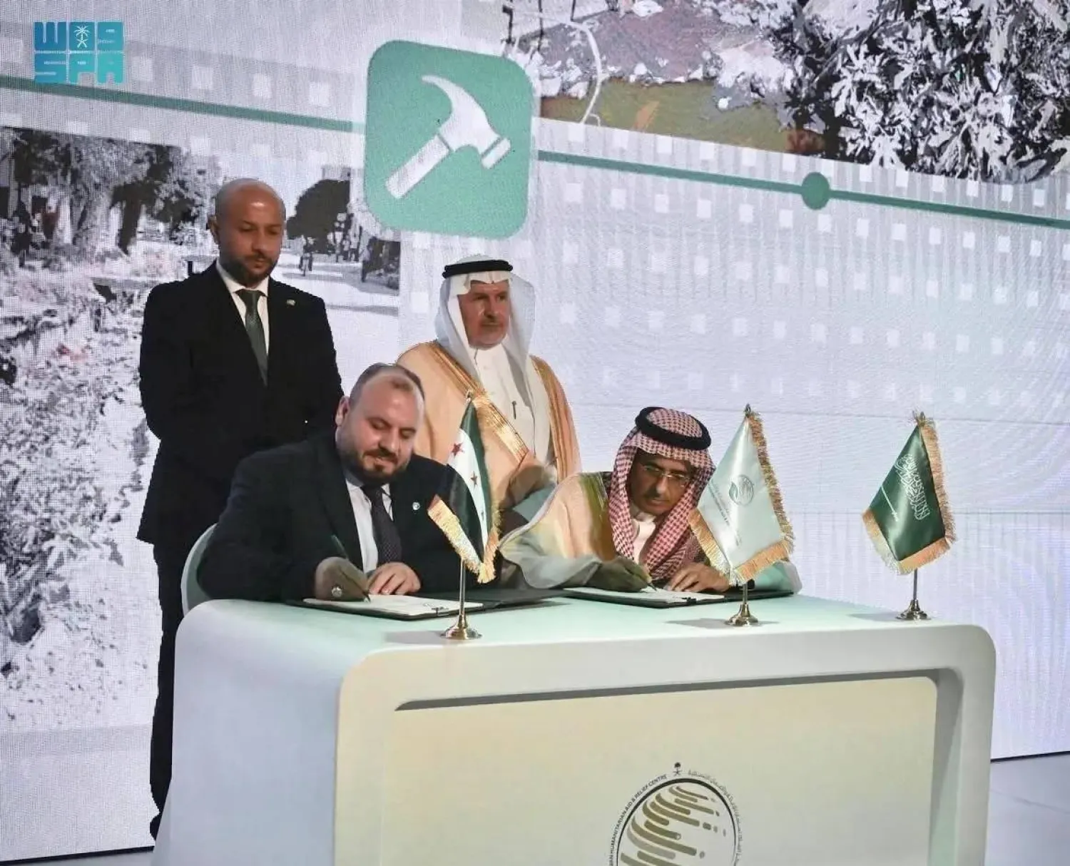 Saudi and Syrian officials are seen at the signing ceremony on Sunday. (SPA)