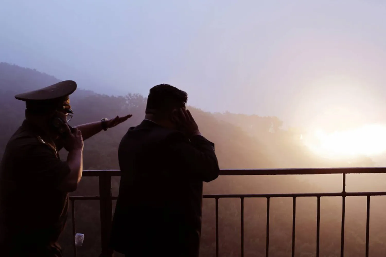 09 September 2025, North Korea: This photo released by the North's official Korean Central News Agency on September 8, 2025, shows North Korean leader Kim Jong-un (R) watching a test of a high-thrust, solid-fuel missile engine using composite carbon fiber material at an unspecified location. Photo: -/KCNA/YNA/dpa