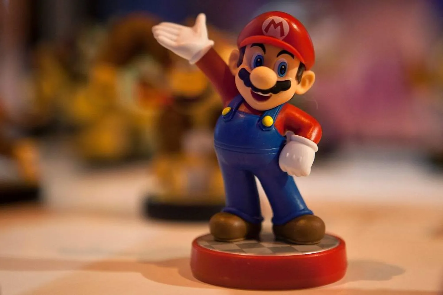 This file photo taken on October 2, 2015 shows a figurine representing Japanese multinational Nintendo's famous video game character Mario Bros on display during the Madrid Games Week 2015 in Madrid. (AFP)
