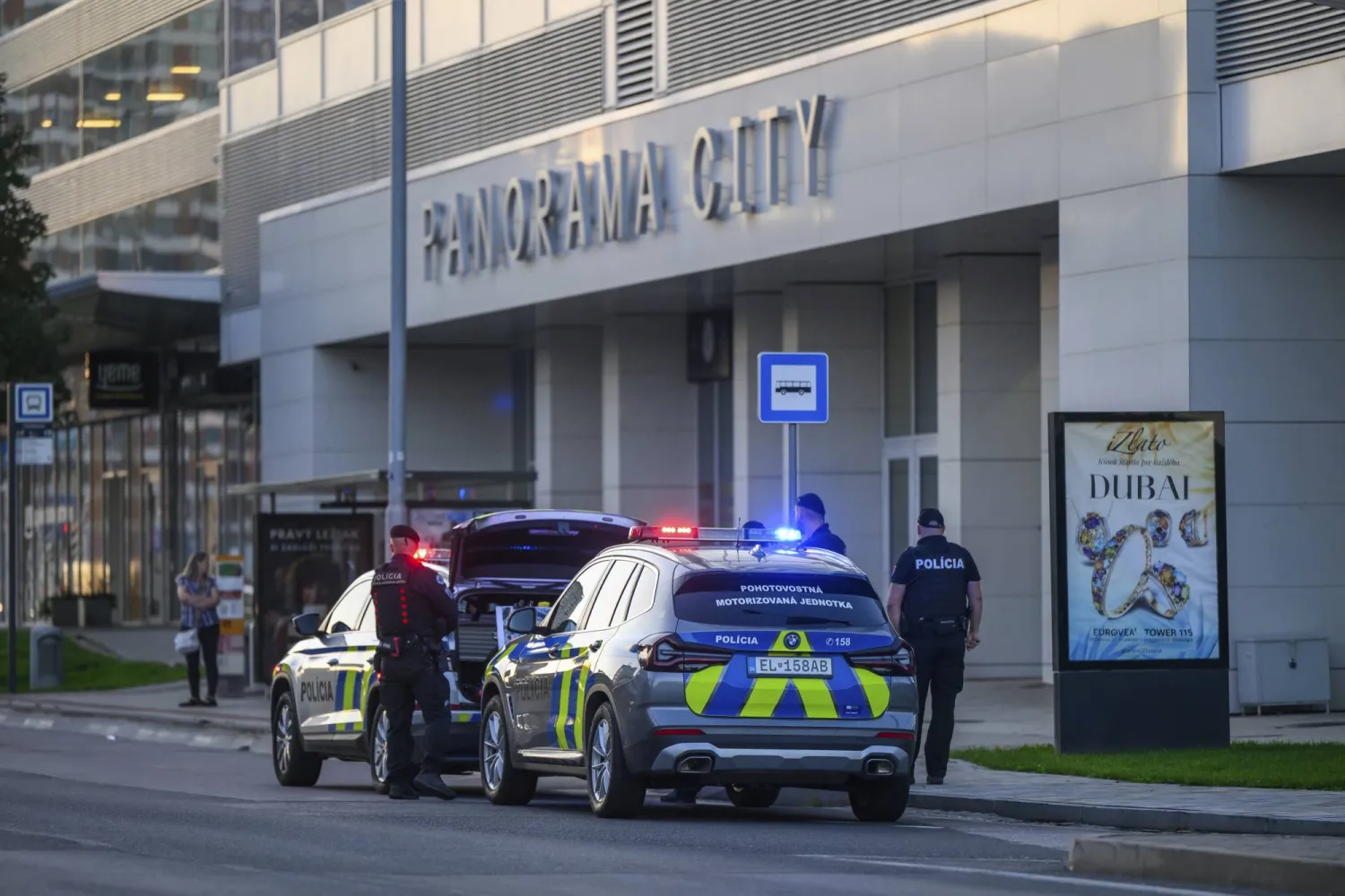 Police secure the evacuation of people from buildings due to the discovery of a World War II bomb on Landererova Street in Bratislava, Tuesday, Sept. 9, 2025. (Jaroslav Novak/TASR via AP)