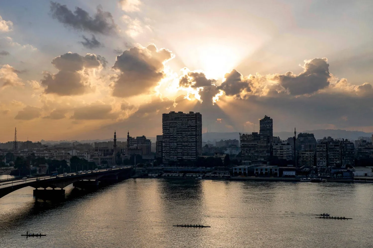 Rowers ride their skiffs in the Nile river waters off of central Cairo's Manial al-Roda island at sunrise early on September 8, 2025. (Photo by MOHAMMED ABED / AFP)