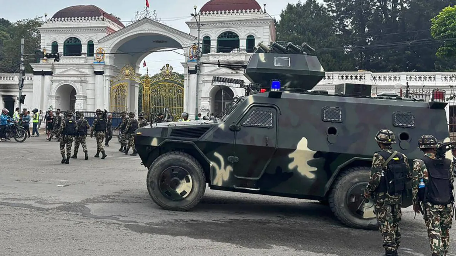 Army personnel patrol along a street outside the Singha Durbar, the main administrative building for the Nepal government, in Kathmandu. Paavan MATHEMA / AFP