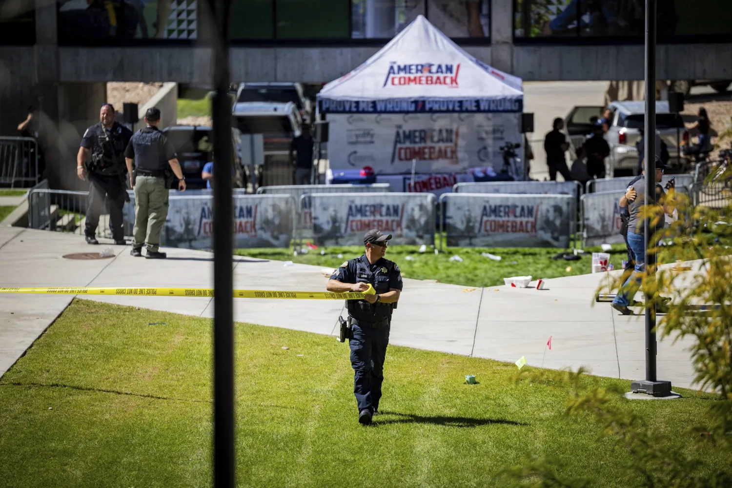 Law enforcement tapes off an area after Charlie Kirk was shot at Utah Valley University, Wednesday, Sept. 10, 2025, in Orem, Utah. (Tess Crowley/The Deseret News via AP)