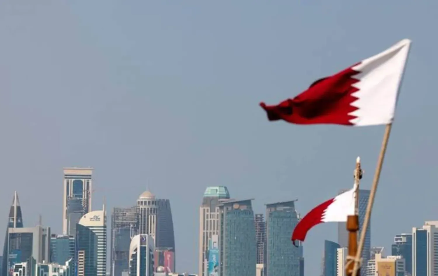 Qatari flag flutters in Doha - AAWSAT/File

