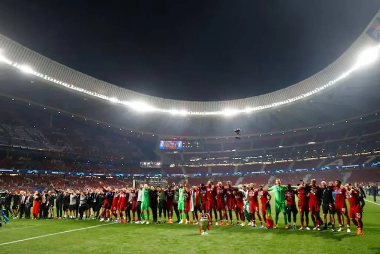 Soccer Football - Champions League Final - Tottenham Hotspur v Liverpool - Wanda Metropolitano, Madrid, Spain - June 1, 2019 General view of Liverpool players and staff celebrating alongside the trophy in front of their fans after winning the Champions League REUTERS/Kai Pfaffenbach/File Photo